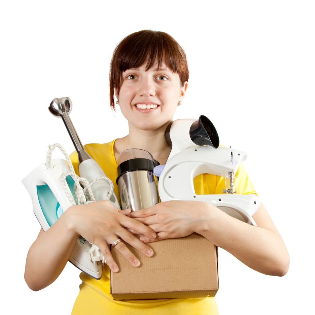 woman with household appliances over white